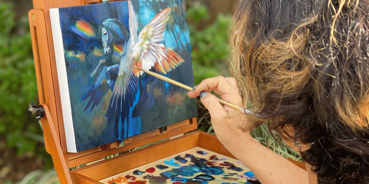 Elli Milan painting a Pegasus in oils